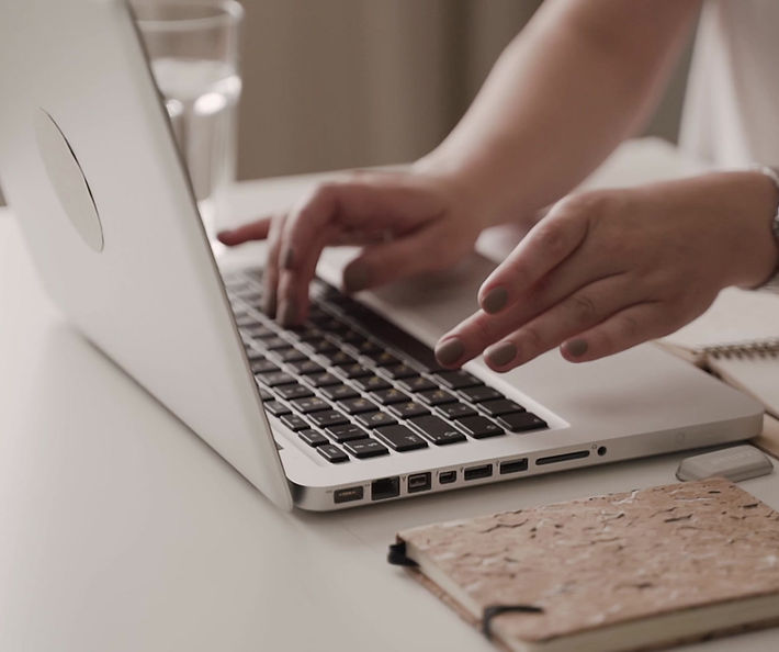 Person typing on laptop